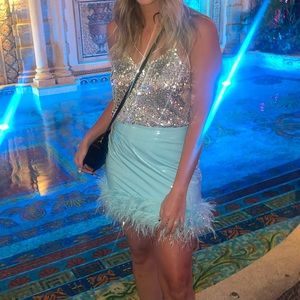 Baby blue leather mini skirt with feathers